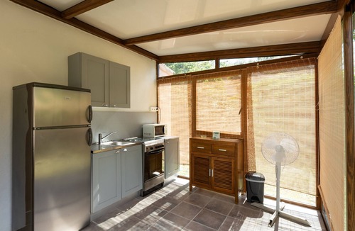 Palasca House | Bungalow “Village Camping De L'Ostriconi G3” with Sea View, Shared Pool and Wi-Fi