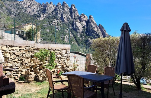 Poggiolo Ski Chalet | Chalet garden between hiking maquis swimming