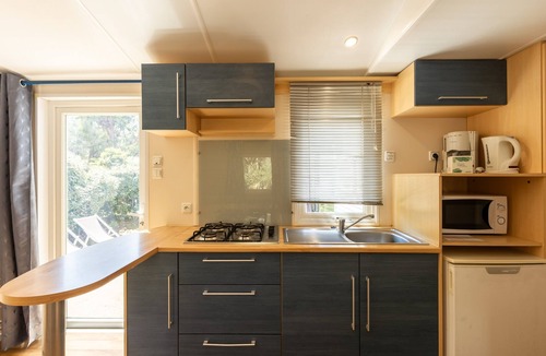 Palasca House | Mobile Home 'Village Camping De L'ostriconi 27' with Sea View, Shared Pool and Wi-Fi