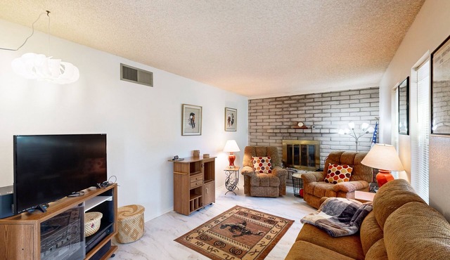 Single-level home with large yard, patio, grill, mountain views